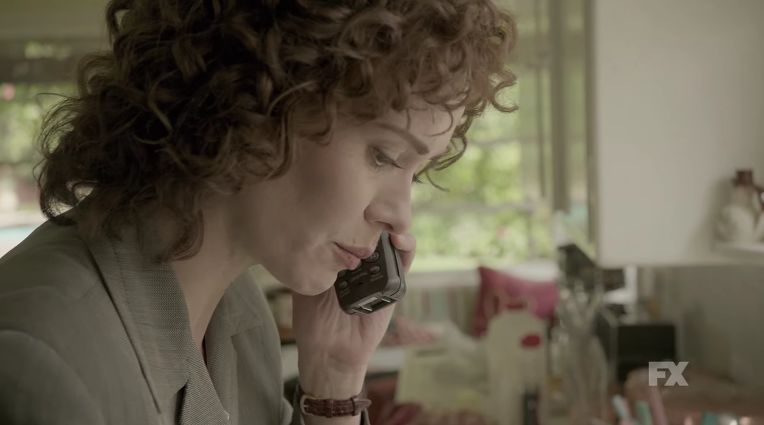 The cordless phone says "90s Chic", and the perm says "Of course this isn't my first divorce!"